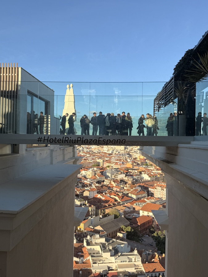 Glass skywalk view over Madrid from 360 Sky Bar at Hotel Riu Plaza España