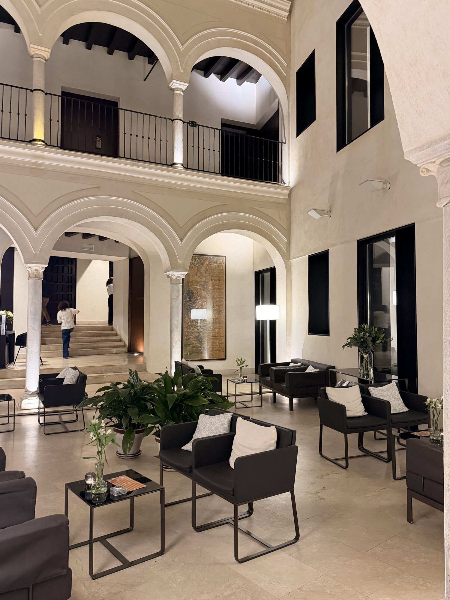 Lounge seating inside the historic courtyard at Hotel Posada del Lucero in Seville