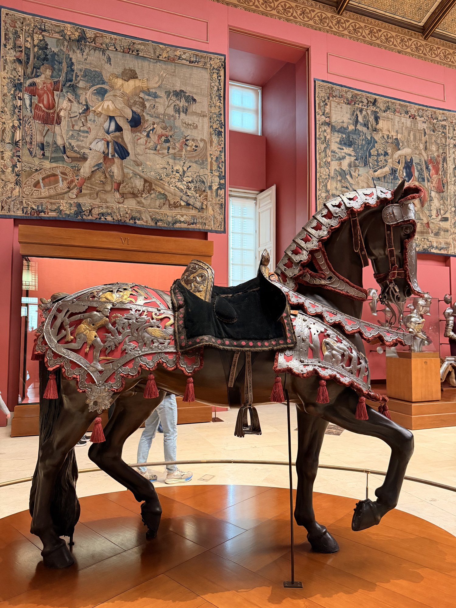 A full suit of engraved horse armor on a life-size model horse in the Royal Armoury of Madrid