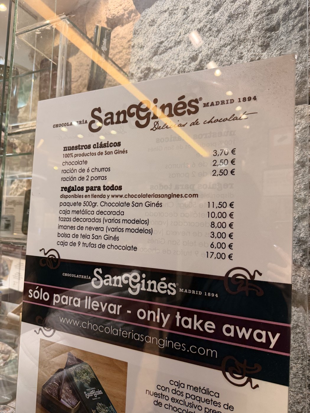 Chocolateria San Gines menu board in Madrid with churros and chocolate prices