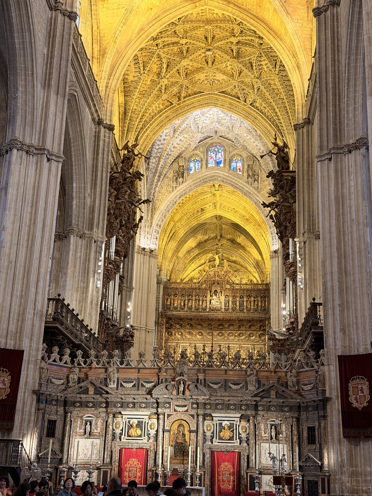 The nave and gilded main altarpiece inside Seville Cathedral